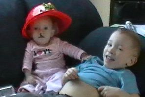 Autumn (before surgery) hanging with big brother, who thought she should be a fireman :) 